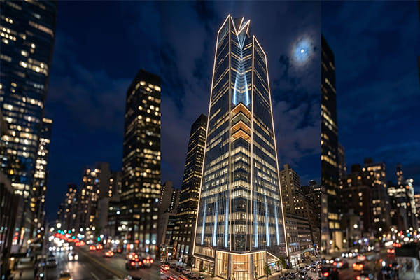 A skyscraper with layered lighting, showing contour, accent, and ambient light.